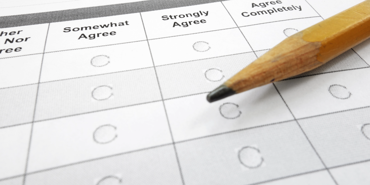 Pencil laying on a printed survey with bubbles to fill in