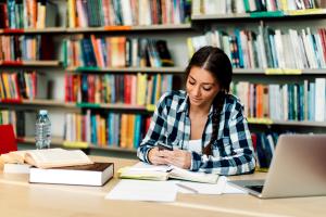 student studying with laptop